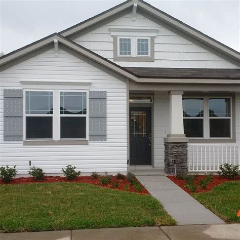 gray siding with white shutters